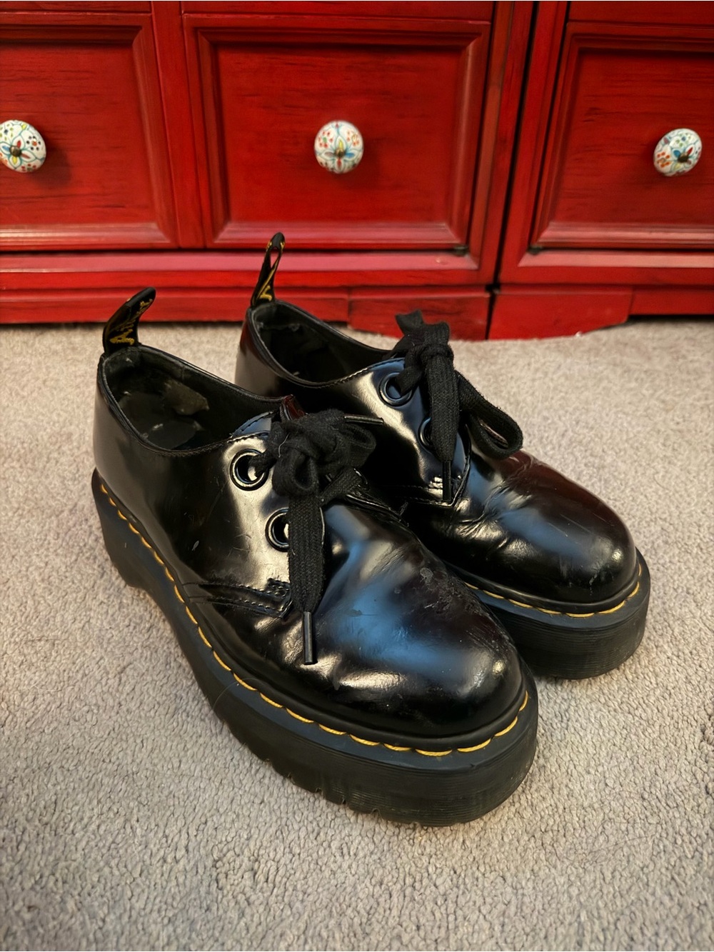 Dr. Martens Black Patent Platform Lace-Up Boots with Yellow Stitching